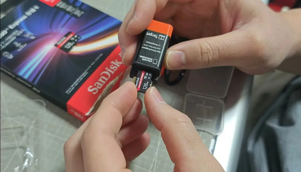 Test setup: inserting microSD EXPRESS into KVM-GO for read/write checks.